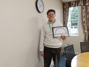 man holding certificate